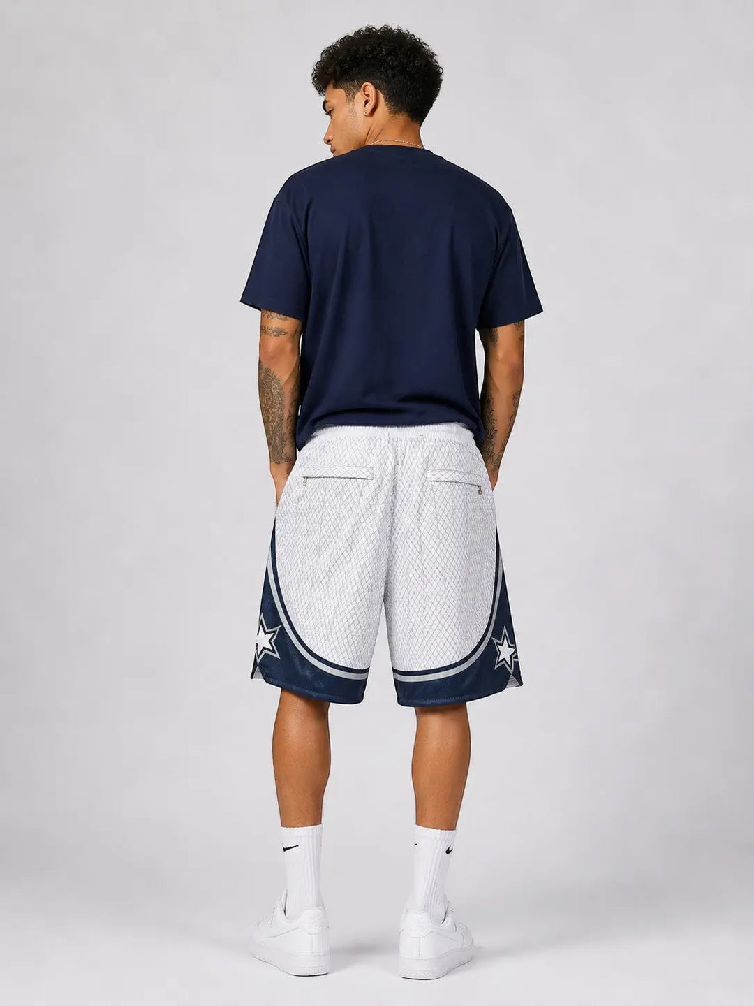 Hoopers white and navy blue retro Orlando Magic basketball shorts with star accents, made of polyester mesh.