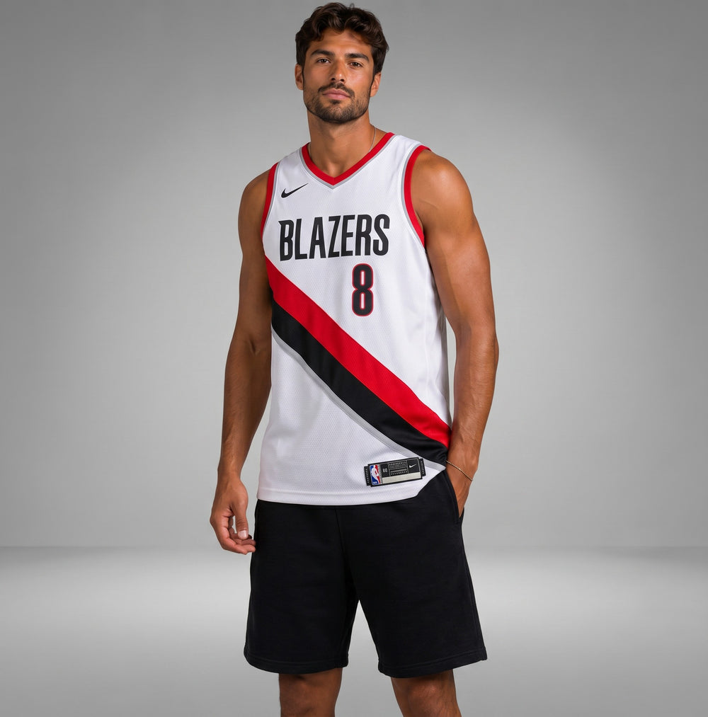 Hoopers white NBA jersey for Deni Avdija of the Portland Trail Blazers, featuring black lettering and red and black diagonal stripes.