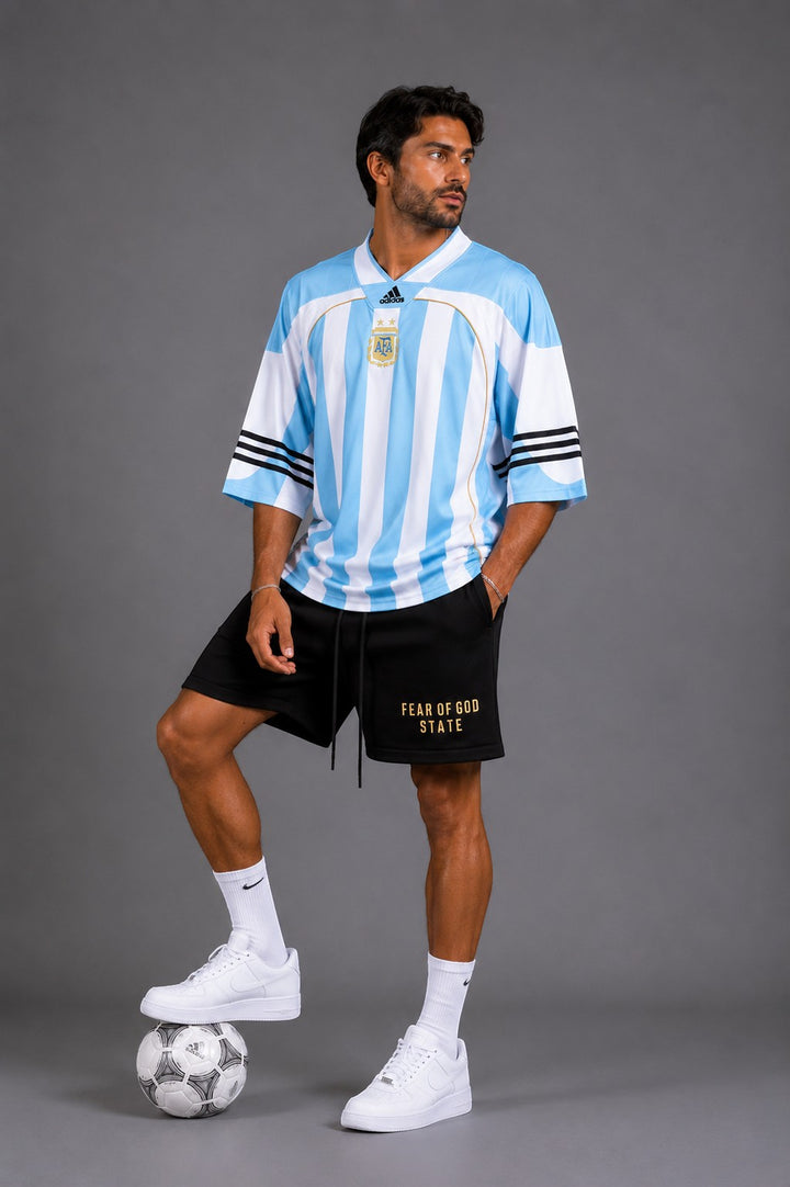Hoopers retro Argentina long sleeve soccer jersey in light blue with white stripes and gold trim. Oversized fit.