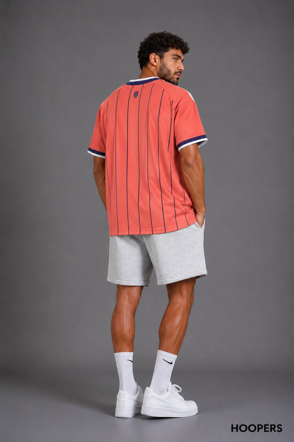 Hoopers Retro Red Edition Scotland jersey with blue pinstripes and vintage V-neck. Loose fit, breathable fabric, classic details.