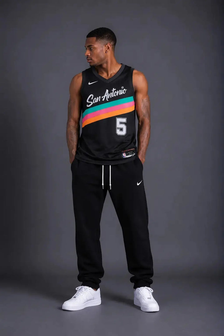 Hoopers black San Antonio Spurs Stephon Castle City Edition 2025/26 jersey with turquoise, pink, and orange stripes.