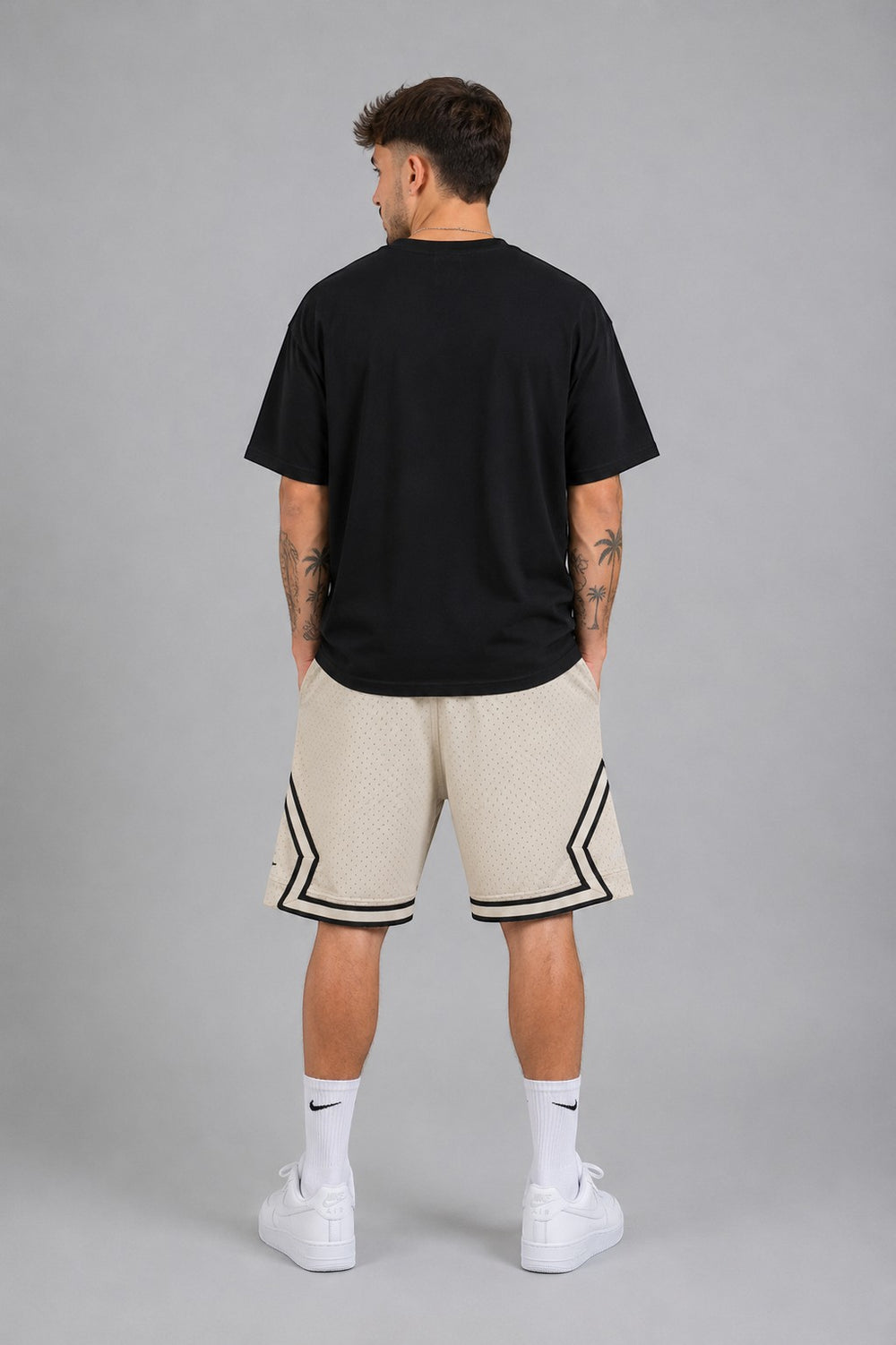Hoopers men's vintage cream mesh basketball shorts with black trim and side stripes.