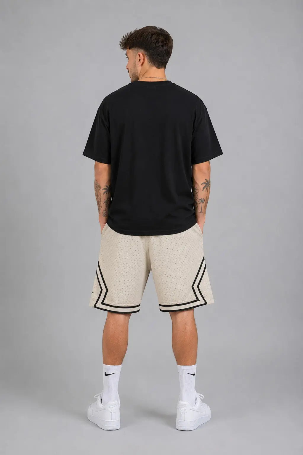 Hoopers men's vintage cream mesh basketball shorts with black trim and side stripes.