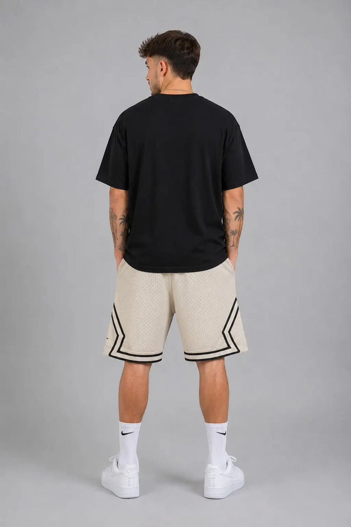 Hoopers men's vintage cream mesh basketball shorts with black trim and side stripes.