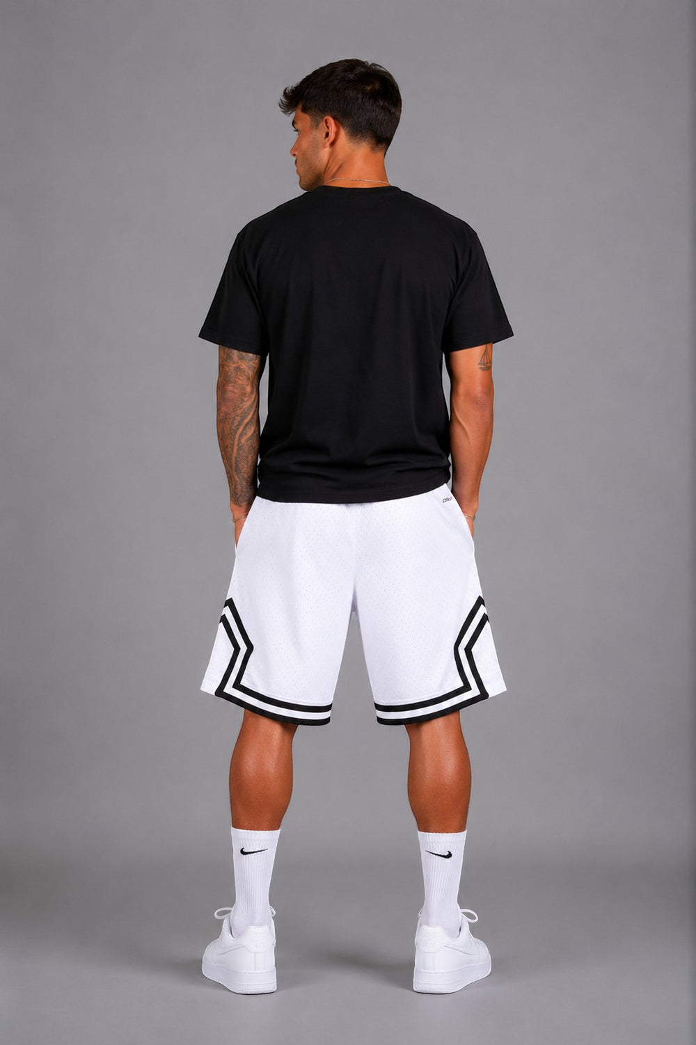 Hoopers men's white mesh basketball shorts with black trim and Jordan logo detail. Relaxed fit.