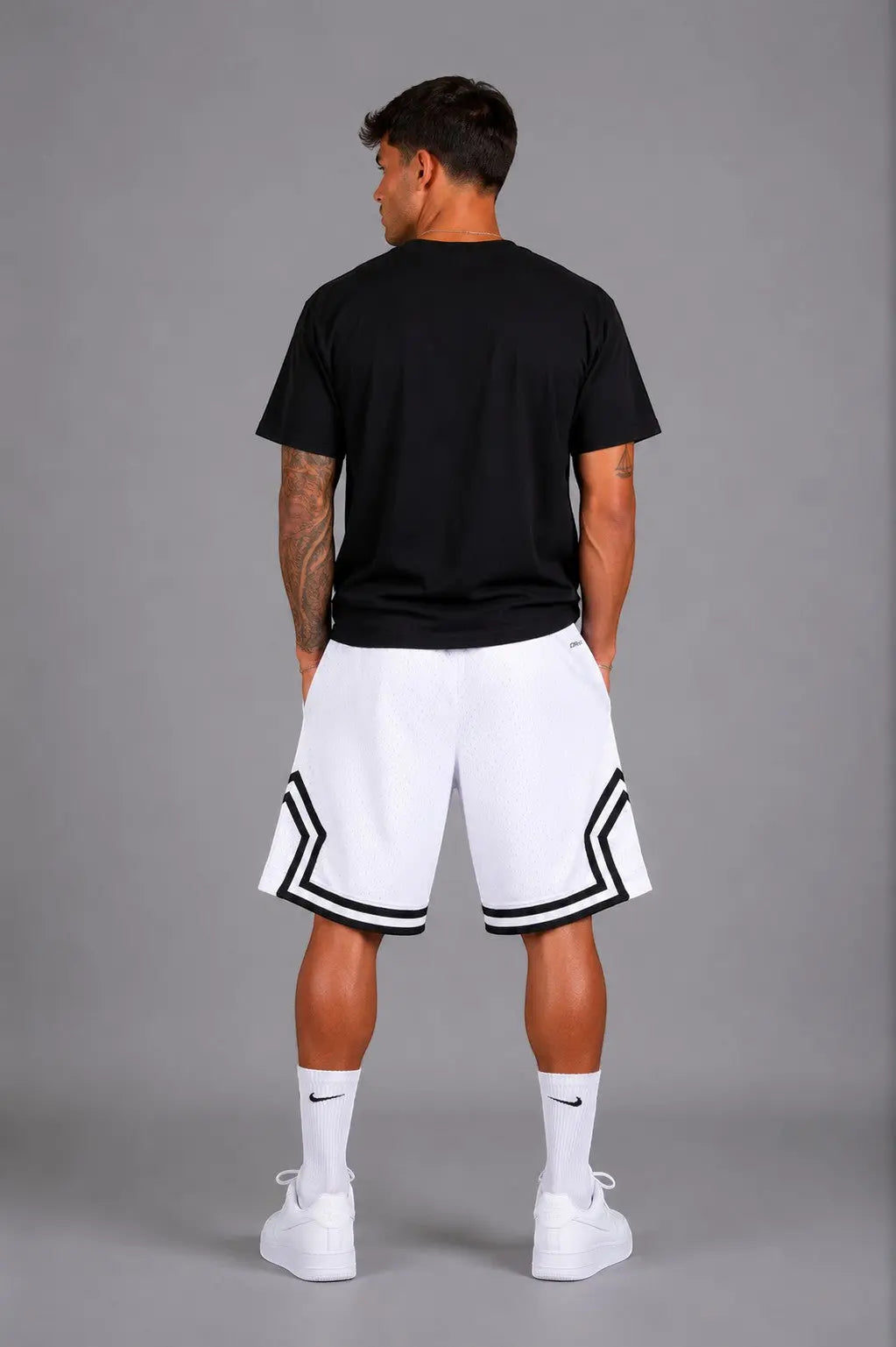 Hoopers men's white mesh basketball shorts with black trim and Jordan logo detail. Relaxed fit.