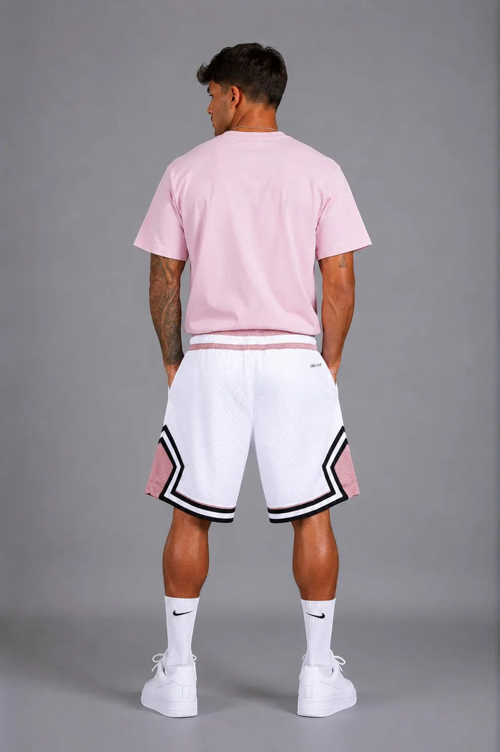 Hoopers men's white mesh basketball shorts with pink and black trim, featuring an oversized fit and Dri-FIT technology.
