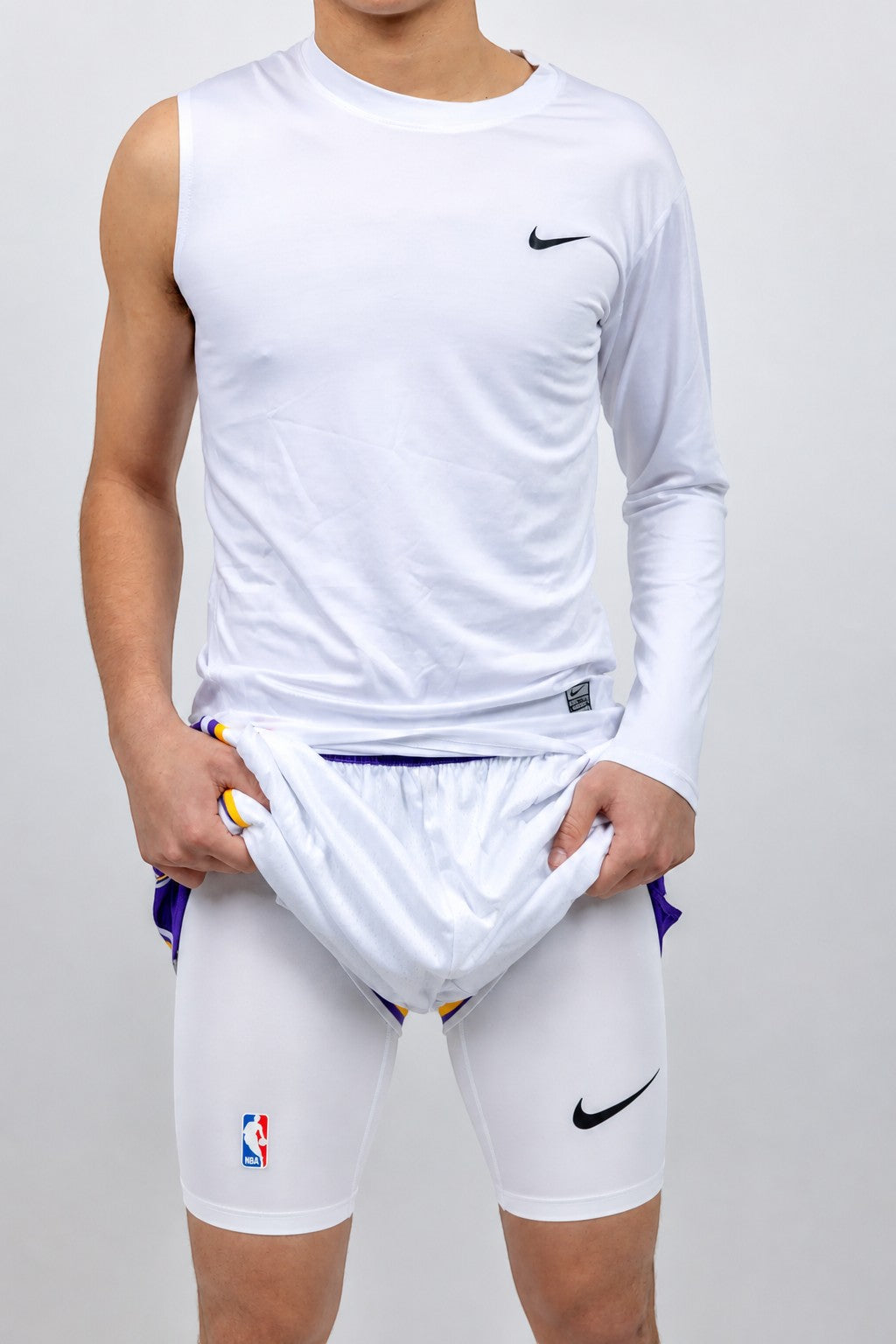 Hoopers white NBA Pro compression tights for basketball players, featuring Nike logo and NBA logo.